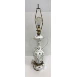 A circa 1900 Bohemian overlaid glass lamp of two handled urn form,