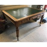 A late Victorian oak library table,