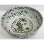 A 19th Century Chinese famille verte fruit bowl decorated with figure and Kylin/Qilin amongst