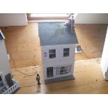 A modern dolls house "Christmas Cottage" as a Georgian townhouse with bay window,