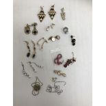 A collection of various costume jewellery including earrings, pendants, moonstone type dress ring,