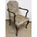 An early 20th Century tapestry upholstered mahogany framed open arm elbow chair in the Georgian