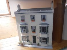 A modern dolls house "Cricklade House" as a three storey Georgian townhouse,