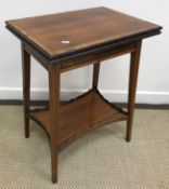An Edwardian rosewood and cross banded fold over tea table on square tapered legs united by an