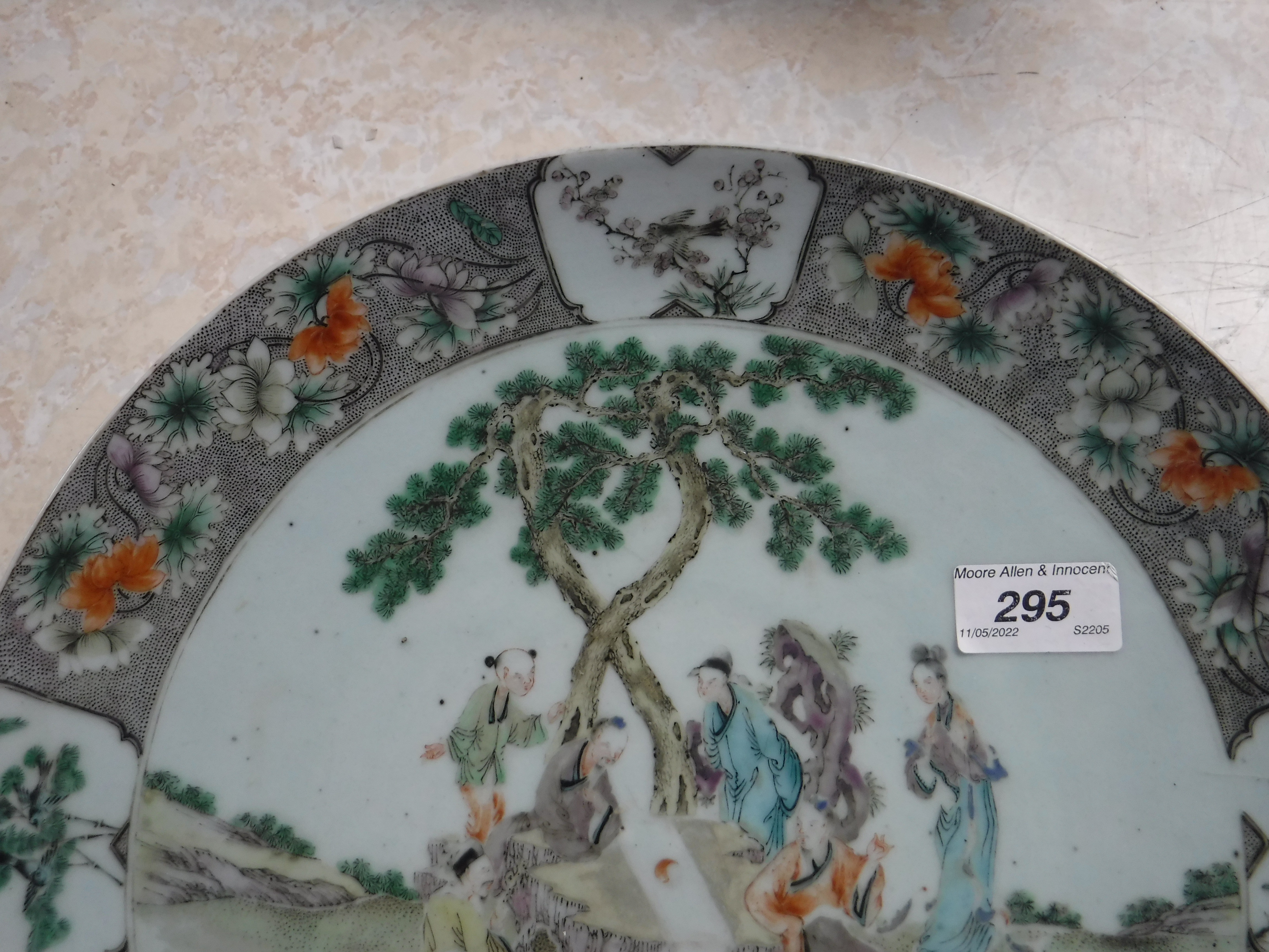 A Kangxi style porcelain charger decorated with figures around a table in a garden setting within a - Image 5 of 14