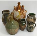 A collection of six various Continental probably French terracotta pots with glazed decoration,
