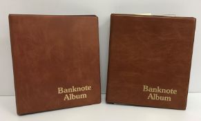 Two bank note albums containing 262 various World and GB bank notes including a Bank of England £5