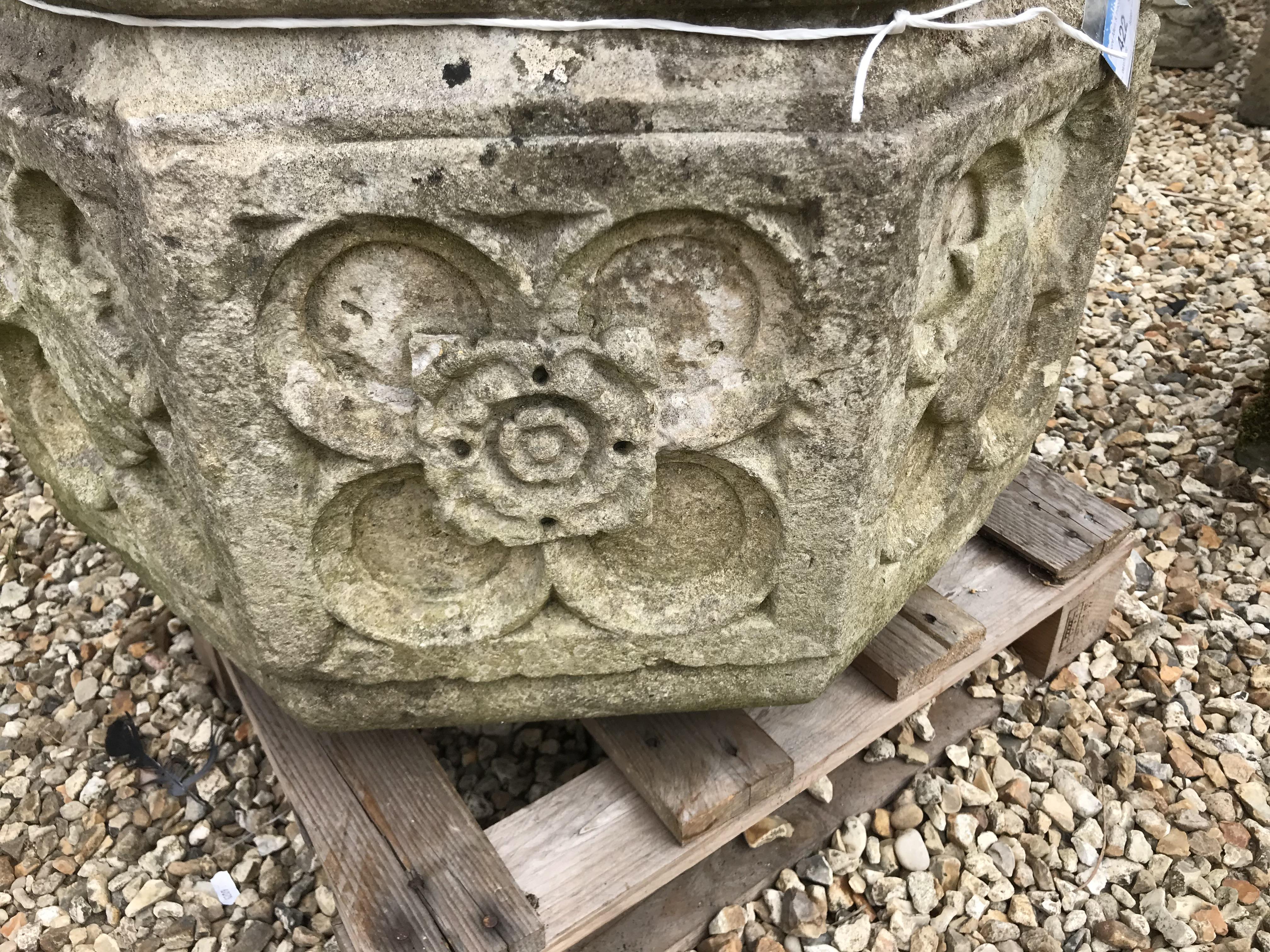 A natural stone font of octagonal form with rose decoration to each side height 45cm width 63cm - Image 5 of 10