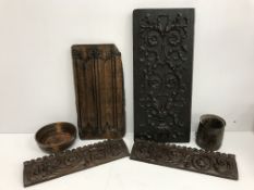 A box containing assorted treen wares to include carved oak furniture embellishment panels,