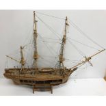 A scale model "HMS Bounty 1783" with cutaway side, on stand,