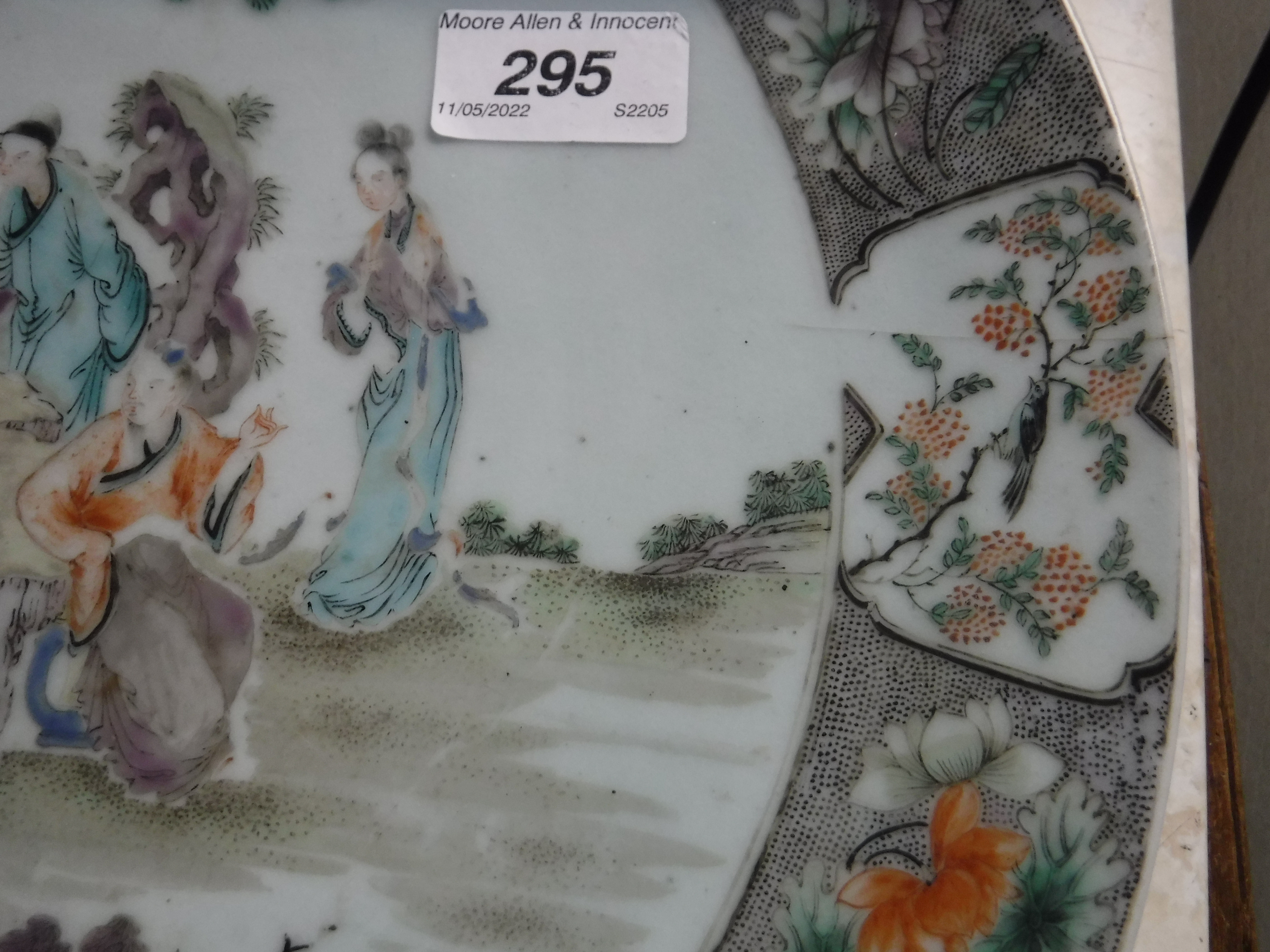A Kangxi style porcelain charger decorated with figures around a table in a garden setting within a - Image 8 of 14