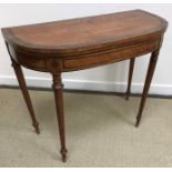 A 19th Century satinwood and rosewood inlaid bow fronted fold-over card table,