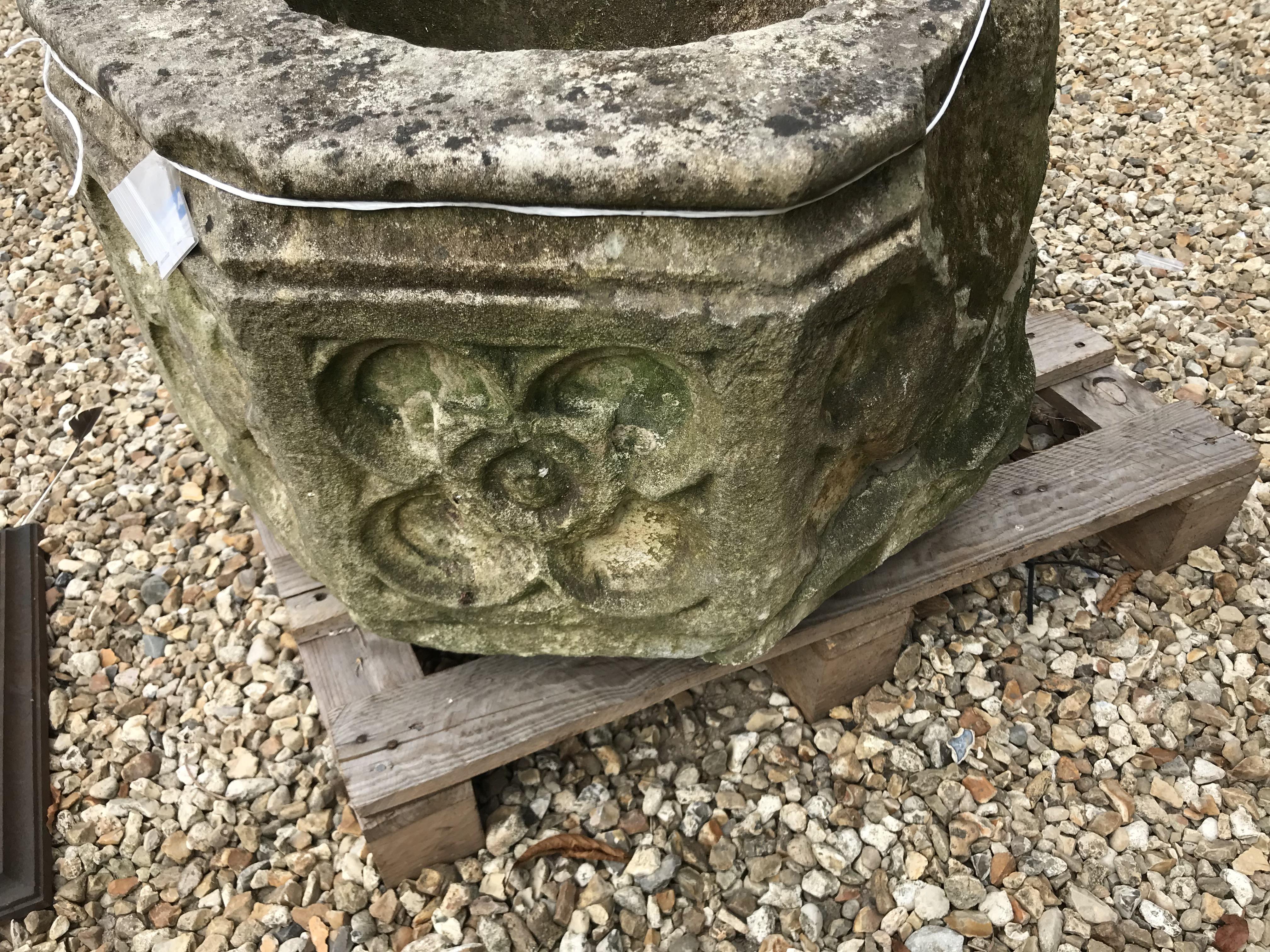 A natural stone font of octagonal form with rose decoration to each side height 45cm width 63cm - Image 9 of 10