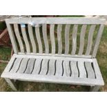 A Britannic teak bench seat in the Lutyen style with wavy decoration CONDITION REPORTS
