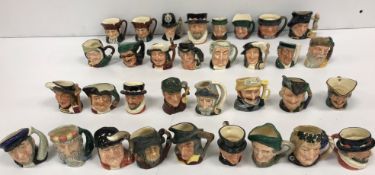 A collection of miniature Royal Doulton Toby jugs comprising "The London Bobby" (D6763),