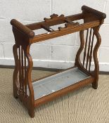 A circa 1900 oak three section stick/hall stand with metal drip tray flanked by spindle turned end