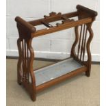 A circa 1900 oak three section stick/hall stand with metal drip tray flanked by spindle turned end