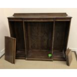 A near matching pair of early 20th Century oak open bookcases with adjustable shelving 142 cm wide