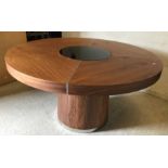 A modern walnut circular dining table with remote controlled light up glass intregral Lazy Susan