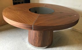 A modern walnut circular dining table with remote controlled light up glass intregral Lazy Susan