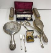 A collection of silver wares to include a dressing table set (by William Hutton & Sons Ltd),