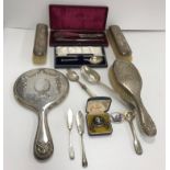 A collection of silver wares to include a dressing table set (by William Hutton & Sons Ltd),