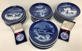 A collection of approximately 29 Royal Copenhagen Christmas plates mainly '70s and '80s together