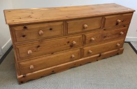 A modern pine chest of three short over two banks of two longer drawers on bracket feet, 172.