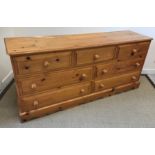 A modern pine chest of three short over two banks of two longer drawers on bracket feet, 172.