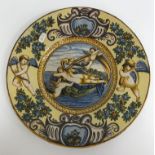 A pair of Urbino style plates/chargers each with cherubic and floral decoration to the border and