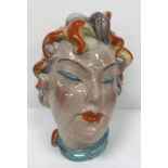 A Continental glazed pottery figure of a "Lady's head" in the Art Deco Goldscheider manner, No'd.