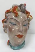 A Continental glazed pottery figure of a "Lady's head" in the Art Deco Goldscheider manner, No'd.