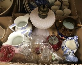 Two boxes of assorted china and glassware to include a pair of glass candlesticks,