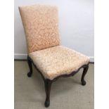 An 18th Century carved walnut framed upholstered side chair, the seat with scrollwork carved rails,