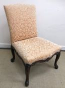 An 18th Century carved walnut framed upholstered side chair, the seat with scrollwork carved rails,