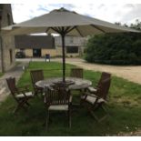 A teak garden table together with a cream canvas covered parasol together with a set of six Royal