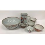A collection of Oriental wares to include Imari palette mug, famille rose bowl, various tea bowls,