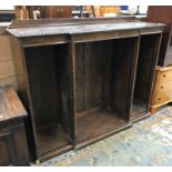 A mid 20th Century oak break front open bookcase raised on a plinth base 153 cm wide x 44.