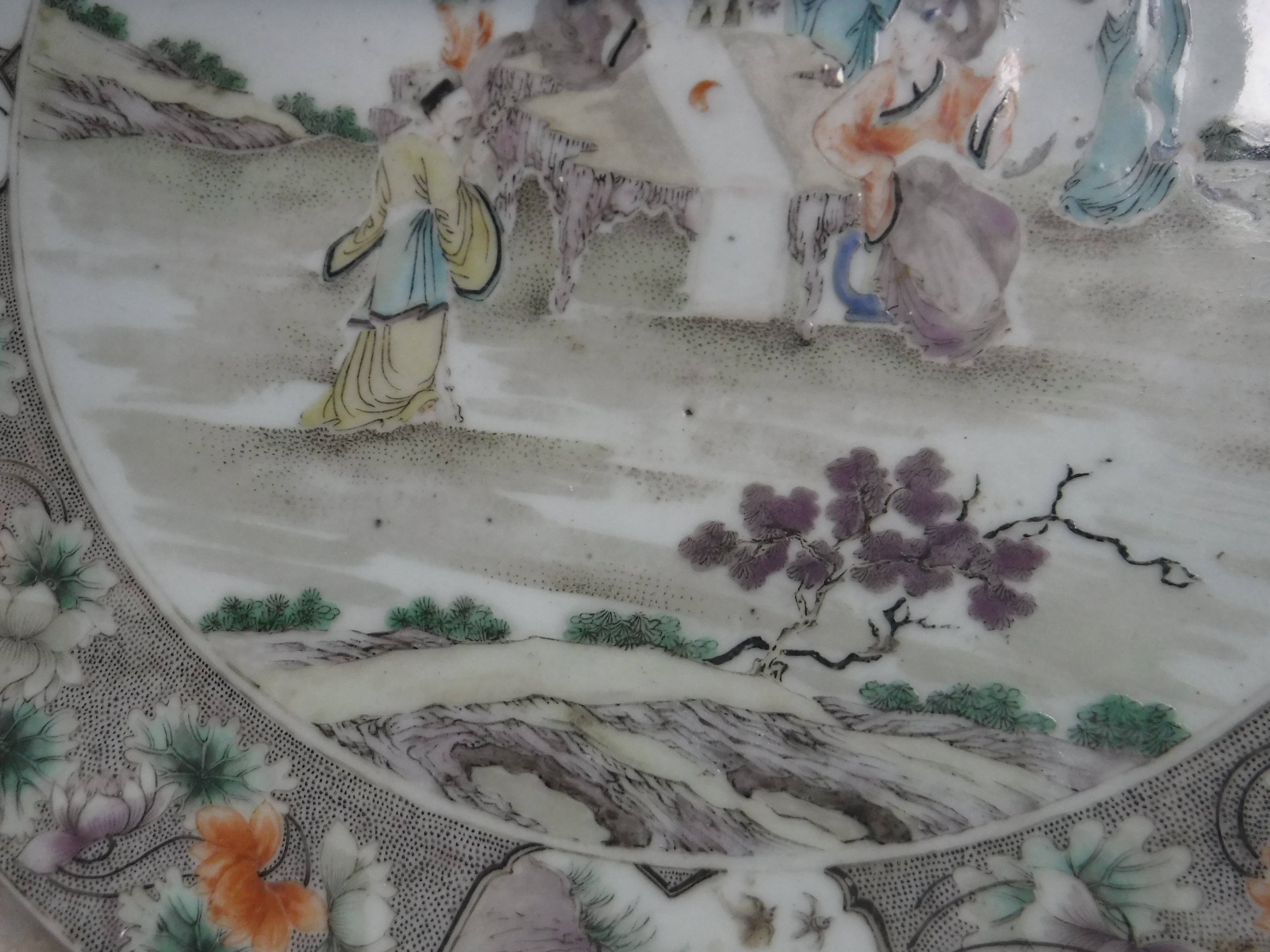 A Kangxi style porcelain charger decorated with figures around a table in a garden setting within a - Image 10 of 14