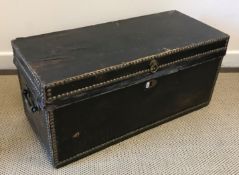 A circa 1800 studded leather trunk of small proportions,