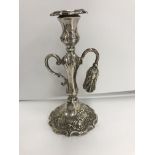 A Victorian silver chamberstick with acanthus leaf decoration and scrolling C handle,