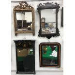 A collection of four mirrors comprising a fretwork carved wall mirror in the early 18th Century