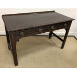 A circa 1900 mahogany side table in the Chippendale taste,