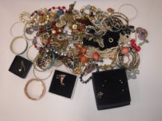 A collection of costume jewellery to include various bangles, bead necklaces,