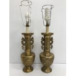 A pair of 20th Century brass table lamps as Chinese vases with phoenix handles and relief work
