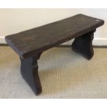 An 18th Century oak bench of small proportions,