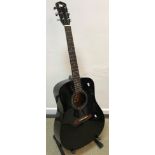 A Fender DG-4/BK acoustic guitar,