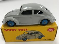 A Dinky Toys Volkswagen Beetle (181) in grey paintwork with blue hubs (boxed)