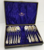 A set of twelve silver and engraved teaspoons (by John Round & Son Ltd,