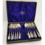 A set of twelve silver and engraved teaspoons (by John Round & Son Ltd,